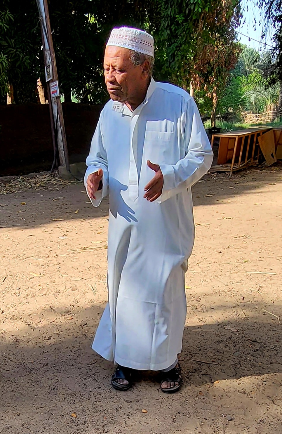 The elder of a Nubian village near Aswan, dressed in traditional white galabiya, outdoors