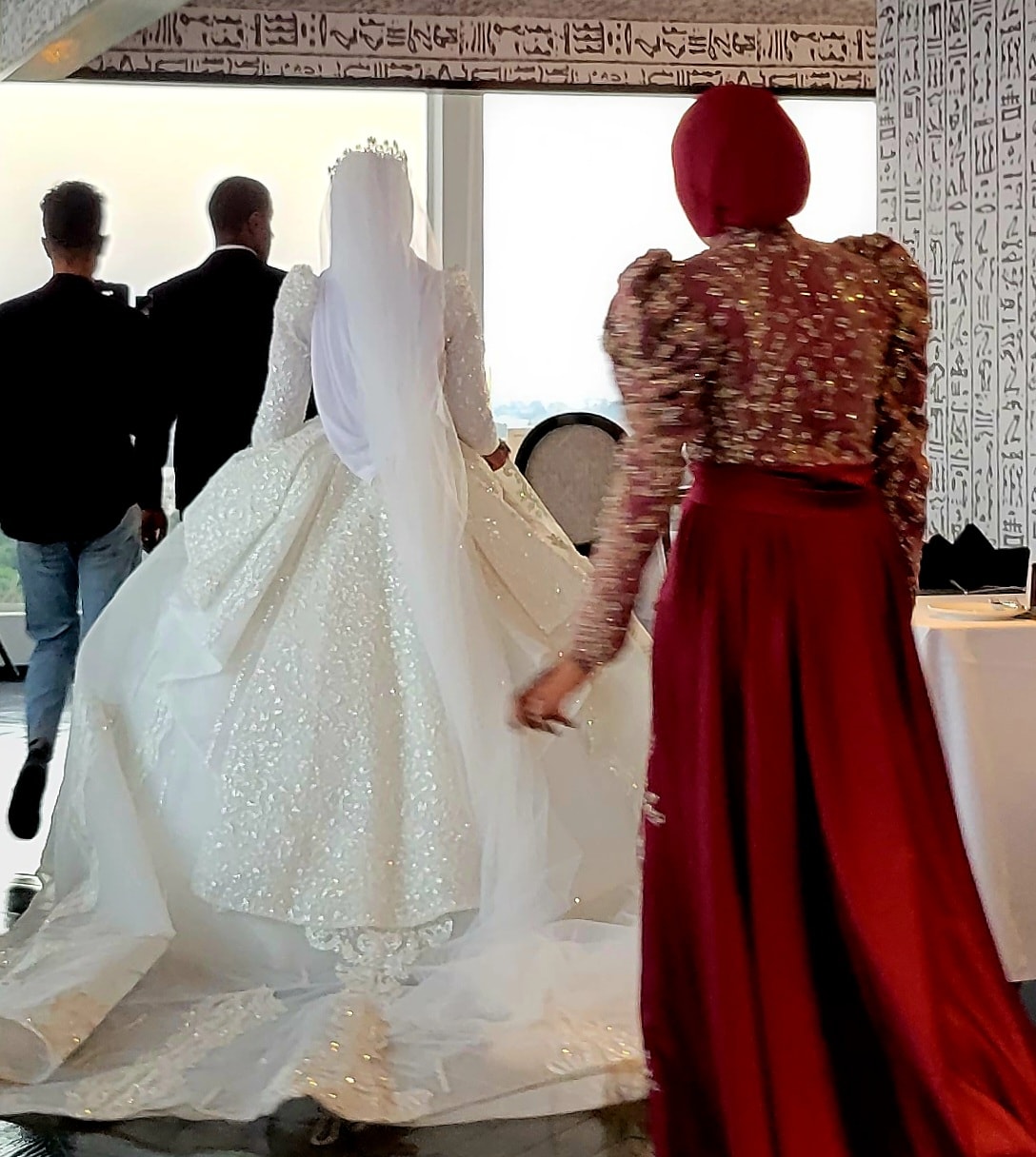 An Egyptian bride in an extraordinary white gown at a wedding celebration in Aswan